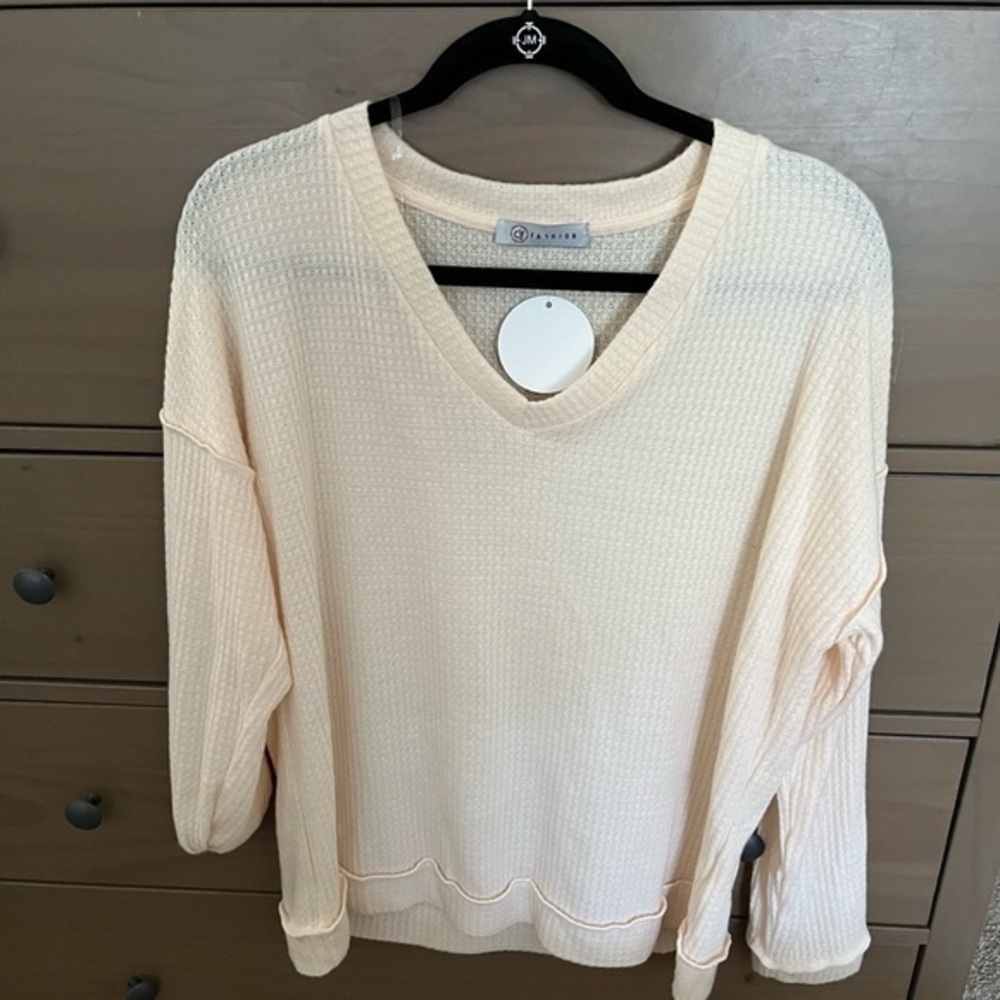 NWT CY Fashion boutique waffle Vneck tunic cream with bottom cuffed.